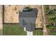 Aerial shot showcasing a well-maintained home with a driveway and a spacious fenced backyard with dirt groundcover at 784 Cypress Rd, Cameron, NC 28326