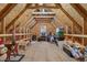 Unfinished attic space with exposed wood beams providing ample room for storage and personalization at 784 Cypress Rd, Cameron, NC 28326