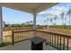 Cozy back porch with a fire pit table, perfect for relaxing and enjoying the view at 784 Cypress Rd, Cameron, NC 28326