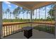 Cozy back porch with a fire pit table, perfect for relaxing and enjoying the view at 784 Cypress Rd, Cameron, NC 28326