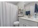 Modern bathroom features a vanity with a white countertop, brushed nickel faucet, and shower at 784 Cypress Rd, Cameron, NC 28326