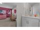 Bright Bedroom with attached bathroom, white vanity and neutral walls at 784 Cypress Rd, Cameron, NC 28326
