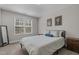 Comfortable bedroom featuring large window, neutral walls, and a cozy bed at 784 Cypress Rd, Cameron, NC 28326
