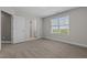 Spacious bedroom featuring carpet, neutral walls, and a large window that provides ample natural light at 784 Cypress Rd, Cameron, NC 28326
