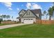 Charming two-story home with a two-car garage, well-manicured lawn, and fenced backyard at 784 Cypress Rd, Cameron, NC 28326