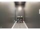 Narrow hallway with neutral walls and a small shelf unit for storage at 784 Cypress Rd, Cameron, NC 28326