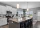 Modern kitchen with a spacious island, white cabinets, and stainless steel appliances at 784 Cypress Rd, Cameron, NC 28326