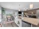 Open-concept kitchen island with granite countertops, stainless steel appliances, and seamless flow to living area at 784 Cypress Rd, Cameron, NC 28326