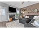Cozy living room with a fireplace, TV, and comfortable seating arrangement at 784 Cypress Rd, Cameron, NC 28326