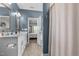 Main bathroom featuring double sinks, white cabinets and access to shower and toilet room at 784 Cypress Rd, Cameron, NC 28326