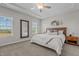 Serene main bedroom featuring a tray ceiling, a bed, and plenty of natural light at 784 Cypress Rd, Cameron, NC 28326