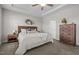 Cozy main bedroom with tray ceiling, wooden furniture, and plenty of storage space at 784 Cypress Rd, Cameron, NC 28326
