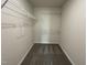 Walk in closet with wire shelving and plush gray carpeting at 81 Coharie Dr, Lillington, NC 27546