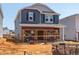 Two story home with blue and grey siding in the process of being completed at 837 Ottawa Dr, Garner, NC 27529