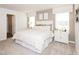Calm main bedroom with a neutral color palette, a padded headboard, and lots of natural light at 837 Ottawa Dr, Garner, NC 27529