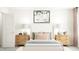 Cozy bedroom with neutral tones, plush bedding, and decorative pillows at 84 Blossom Field Way, Angier, NC 27501