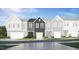 New construction townhome with a one-car garage and traditional architectural details at 84 Blossom Field Way, Angier, NC 27501
