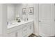 This bathroom features double sinks, white cabinets, and silver accents at 841 Ottawa Dr, Garner, NC 27529