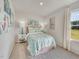 This bedroom offers a comfortable space with a queen size bed and ample natural light at 841 Ottawa Dr, Garner, NC 27529