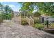 Backyard showcasing a deck, sunroom, and landscaped surroundings at 847 E Maple Ln, Fuquay Varina, NC 27526