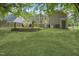 Lovely backyard featuring a deck, screened porch, and lush green grass at 847 E Maple Ln, Fuquay Varina, NC 27526