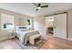 Comfortable bedroom features a decorative rug and a sliding barn door to the bathroom at 847 E Maple Ln, Fuquay Varina, NC 27526