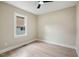 Bright bedroom with light hardwood flooring and a ceiling fan at 847 E Maple Ln, Fuquay Varina, NC 27526