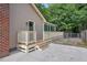 Exterior view of home with sunroom, siding, and outdoor deck and stairs at 847 E Maple Ln, Fuquay Varina, NC 27526