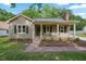 Charming one-story home featuring a welcoming front porch, neutral siding, and lush landscaping, set on a beautiful lot at 847 E Maple Ln, Fuquay Varina, NC 27526