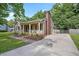 Charming home features a welcoming front porch, neutral siding, and a spacious driveway set on a beautifully landscaped lot at 847 E Maple Ln, Fuquay Varina, NC 27526