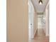 Hallway with fresh paint and hardwood floors at 847 E Maple Ln, Fuquay Varina, NC 27526
