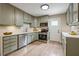 Spacious kitchen showcases stainless steel appliances and sleek countertops at 847 E Maple Ln, Fuquay Varina, NC 27526