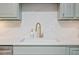 Close-up on bright kitchen with gold faucet and sleek countertops at 847 E Maple Ln, Fuquay Varina, NC 27526