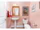 Elegant powder room featuring unique sink, fixtures, and patterned wallpaper at 850 N Langdon, Pittsboro, NC 27312
