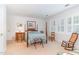 Bedroom with a bright and cheery atmosphere, featuring a four-poster bed at 850 N Langdon, Pittsboro, NC 27312