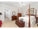 This bedroom features a four-poster bed and neutral walls for a calming and restful retreat at 850 N Langdon, Pittsboro, NC 27312