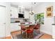 Cozy dining area with lots of natural light, elegant decor and hardwood floors at 850 N Langdon, Pittsboro, NC 27312