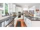 Bright kitchen featuring stainless steel appliances, granite countertops and hardwood floors at 850 N Langdon, Pittsboro, NC 27312
