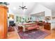 Spacious living room with vaulted ceilings, fireplace, large windows, and an open flow to the dining area at 850 N Langdon, Pittsboro, NC 27312