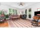Cozy living room with a traditional rug and furniture, complemented by natural light at 850 N Langdon, Pittsboro, NC 27312