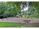 Fun playground with swings, a slide, and a sandbox, ideal for entertainment at 850 N Langdon, Pittsboro, NC 27312