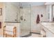 Walk-in shower features neutral tile surround, seamless glass, and chrome fixtures at 850 N Langdon, Pittsboro, NC 27312