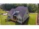 Aerial view of a house featuring a screened porch, wooden deck and a beautiful landscape at 91 Ivy Ridge Rd, Chapel Hill, NC 27516