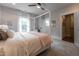 Bedroom with four poster bed, ceiling fan and access to en suite bath and sitting area at 91 Ivy Ridge Rd, Chapel Hill, NC 27516