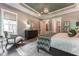Beautiful main bedroom featuring an accent wall, decorative rug, and lots of natural light at 91 Ivy Ridge Rd, Chapel Hill, NC 27516