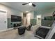 Gaming themed bedroom with mounted TV, lounge chairs, and a bunk bed, great for entertaining at 91 Ivy Ridge Rd, Chapel Hill, NC 27516