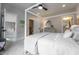 Bedroom with four poster bed, ceiling fan and access to walk-in closet and en suite bath at 91 Ivy Ridge Rd, Chapel Hill, NC 27516