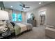 Comfortable bedroom with a ceiling fan, window, and dresser, featuring a walk-in closet at 91 Ivy Ridge Rd, Chapel Hill, NC 27516