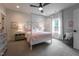 Charming bedroom features a four-poster bed, floral wallpaper, and soft natural light at 91 Ivy Ridge Rd, Chapel Hill, NC 27516