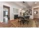 Elegant dining room featuring a fireplace, stylish decor, and a view into the modern kitchen at 91 Ivy Ridge Rd, Chapel Hill, NC 27516